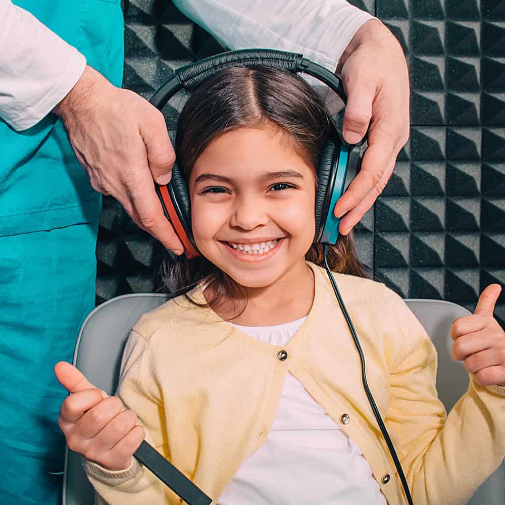 child taking audiological exam